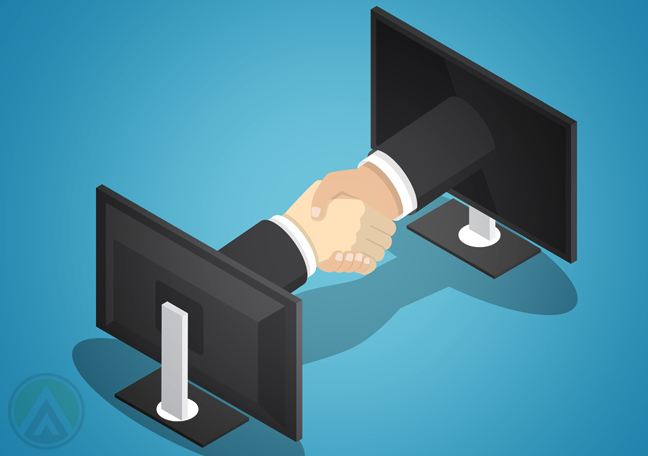 business partners handshake through computer monitors