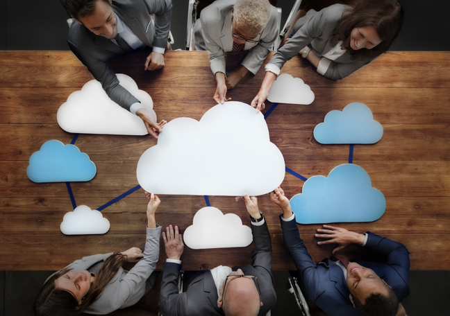 business team holding cloud on table