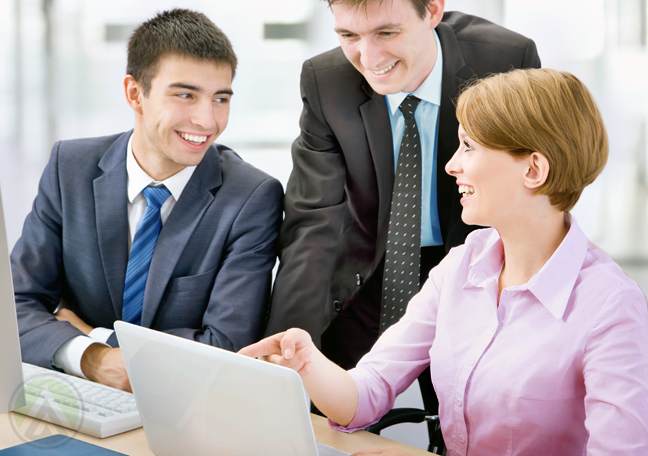 business team in meeting in front of laptop