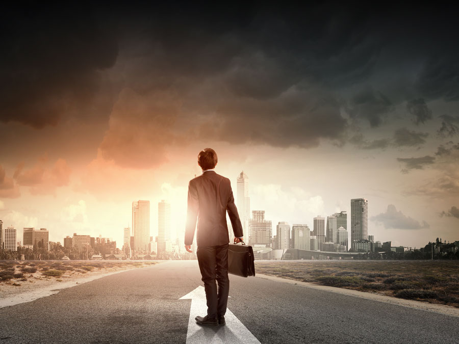 businessman looking at cityscape during a storm