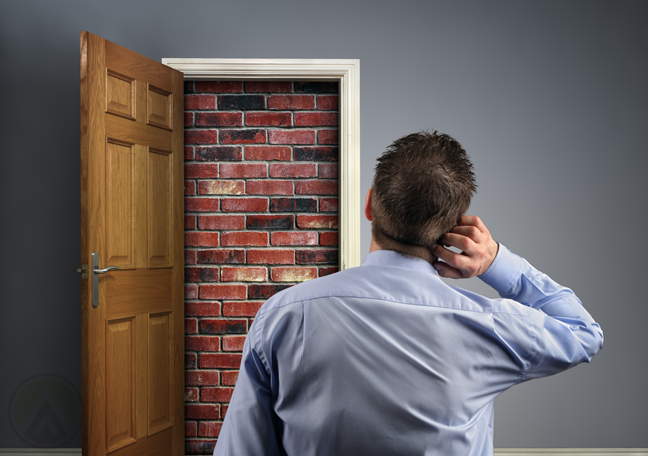 businessman trapped in room red bricks boarded up door