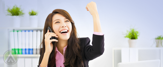 delighted female employee with fist to the air