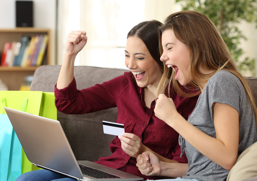 excited women shopping online