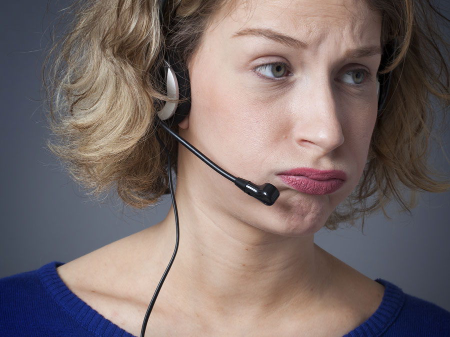 frustrated call center agent looking away