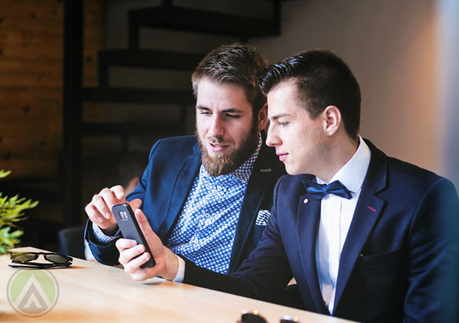 business executive talking to customer about smartphone