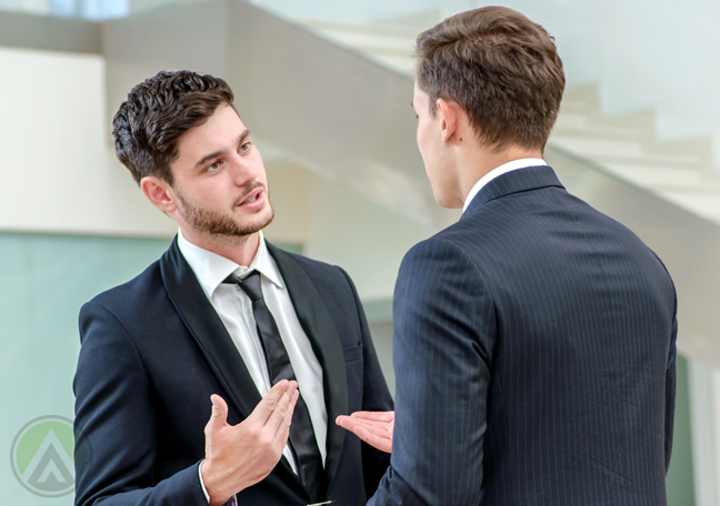 business partners in serious discussion in office