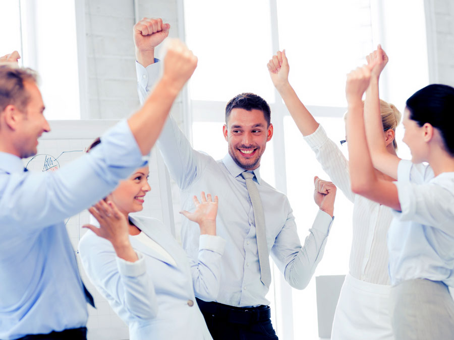 call center coworkers celebrating customer support score