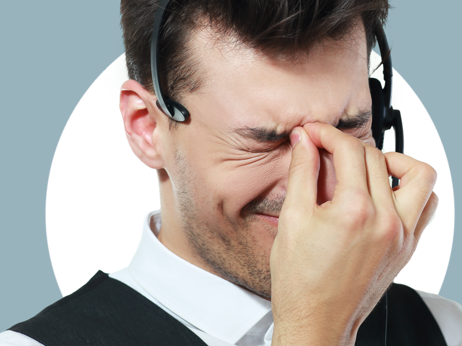 frustrated call center agent squinting