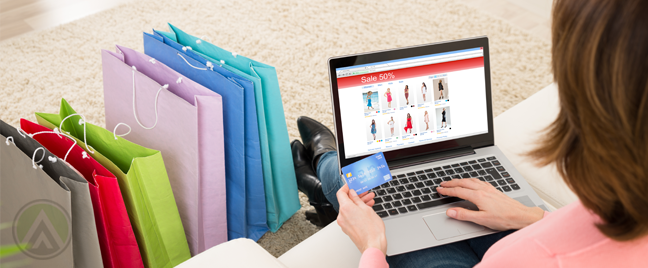 woman holding credit card using laptop online shopping 