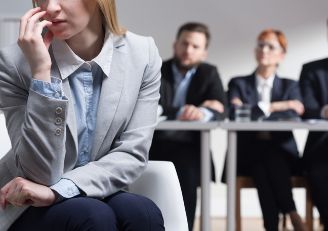 worried job applicant with interviewers