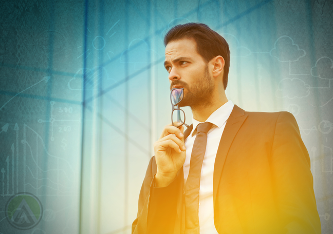 businessman standing outdoors thinking