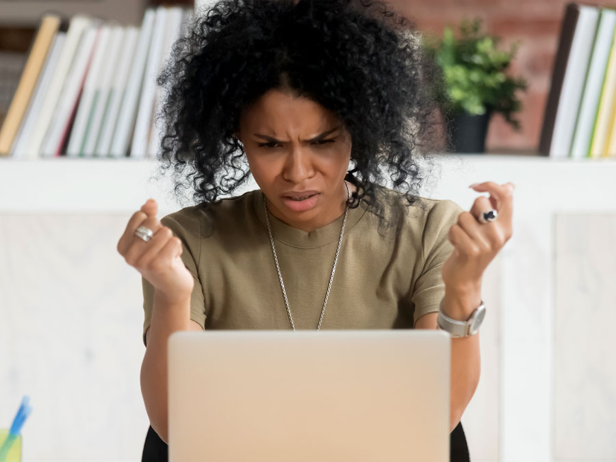 confused customer reading email on laptop