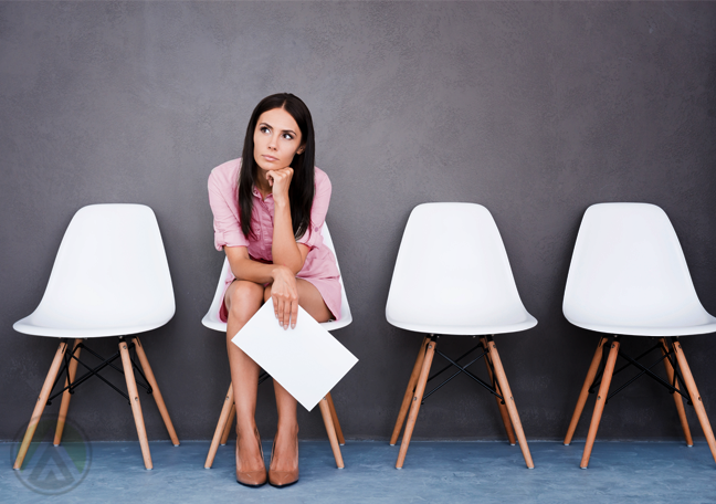 female job applicant sitting alone in waiting room