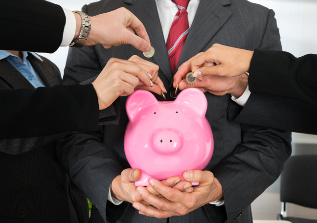 businessman holding pink piggybank employees dropping coins