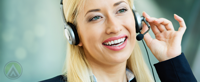 busy call center agent attending to a customer over the phone