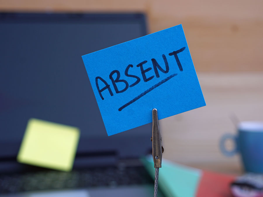 empty call center chair workstation with absent post it sign