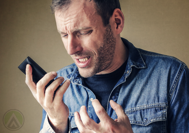 frustrated man making phone call