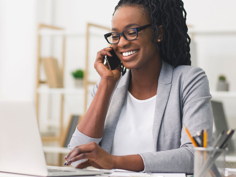smiling woman glasses excited customer experience call center