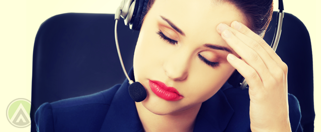 bored customer service call center worker with headache
