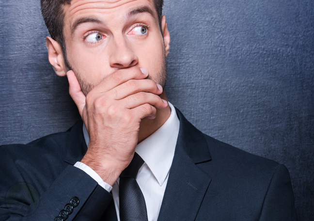 businessman covering mouth