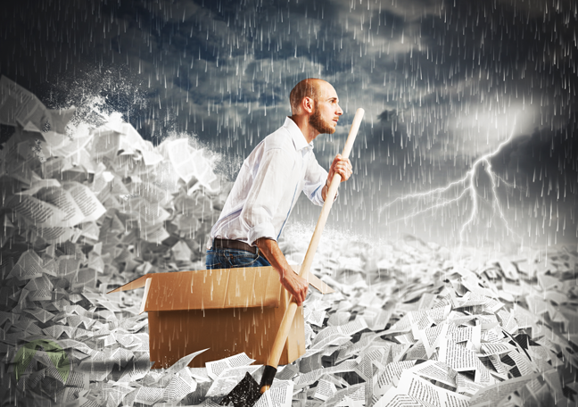 businessman riding cardboard box boat through sea of paper