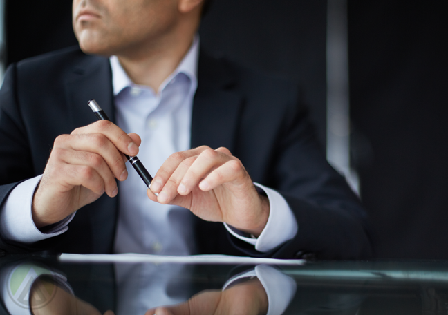 businessman thinking holding pen