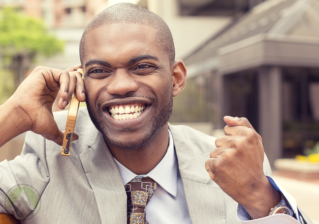 excited man making phone call