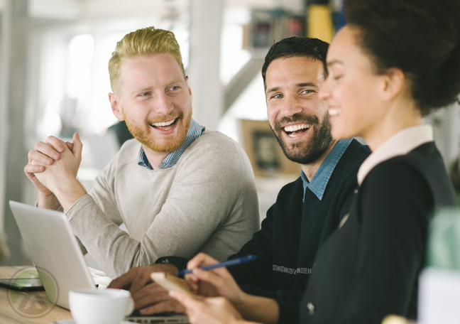 happy coworkers laughing in office pantry