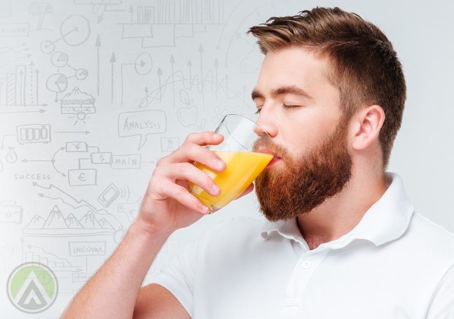 man drinking orange juice with number doodles