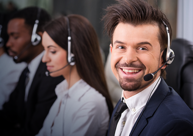 smiling customer care rep with call center team