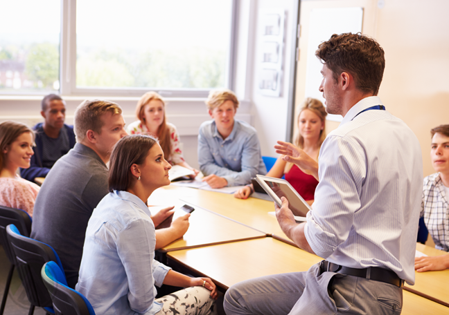 teacher lecturing classroom students