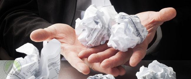 businessman hands holding carrying crumpled paper