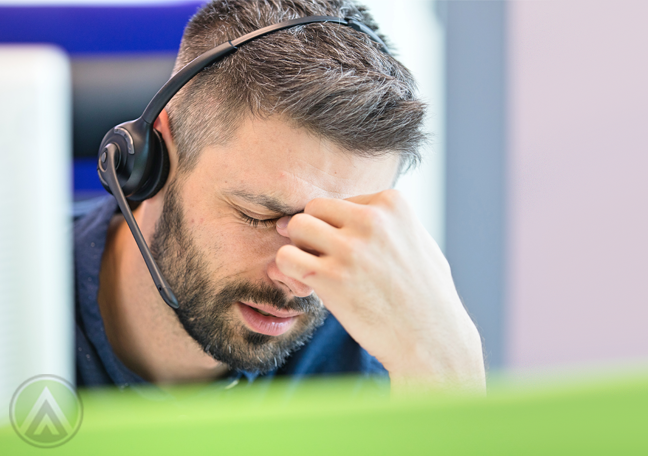 call center customer service worker headache stressed out