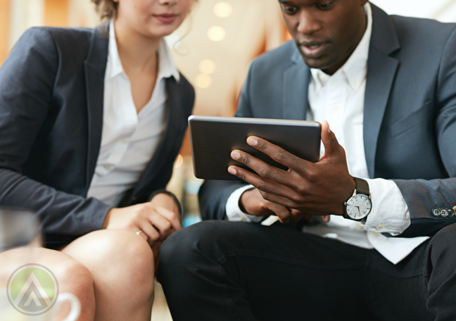 one on one meeting boss reading from tablet