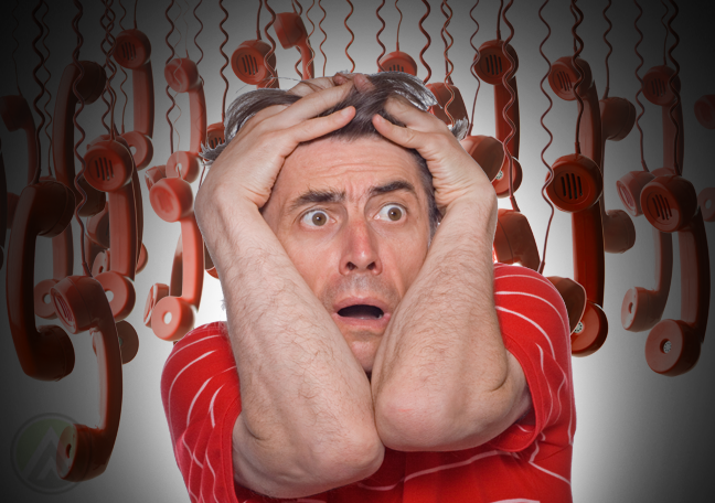 panicking man with red hanging landline telephones in background