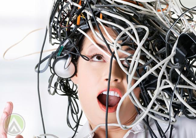 playful office employee tangled wires cable on head