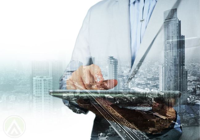 businessman holding urban cityscape buildings skyscrapers