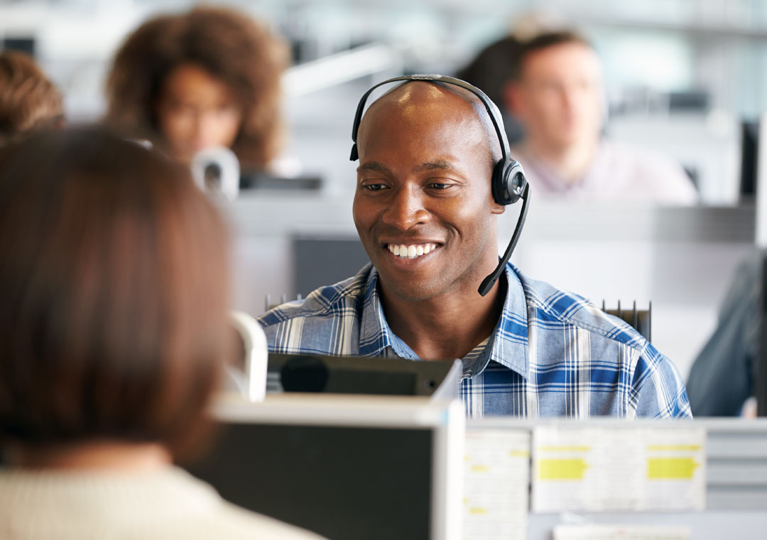 busy customer support agent in call center