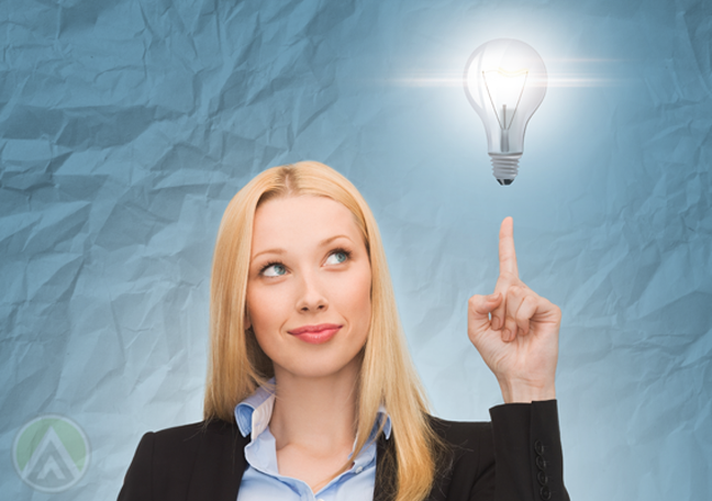 smart business woman with bright idead concept pointing to floating light bulb