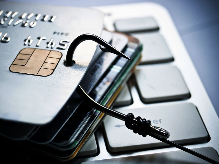 types of ecommerce fraud phishing depiction fishing hook on credit card
