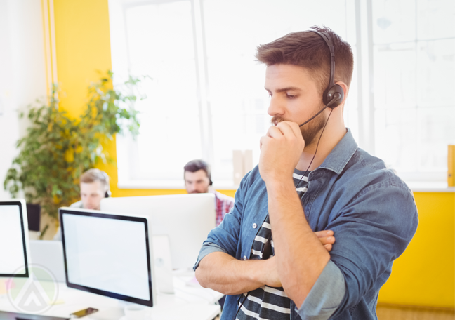 busy call center rep in call in yellow room