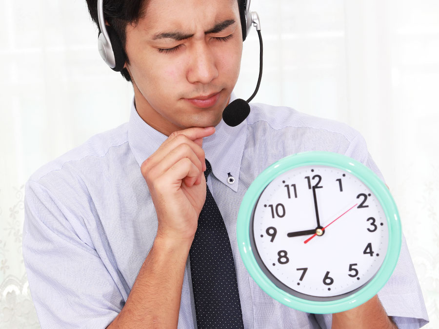 call center agent holding wall clock watching productivity