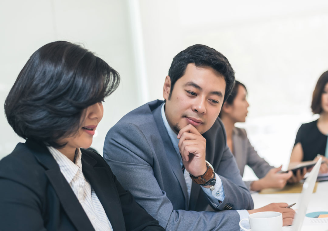 call center team leaders coworkers making decision in meeting