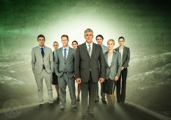 confident business team standing in green mountain landscape