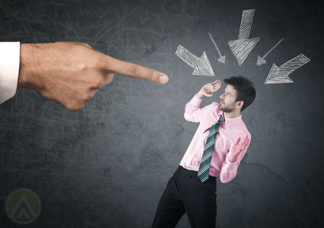 giant businessman hand blaming pointing finger at office employee