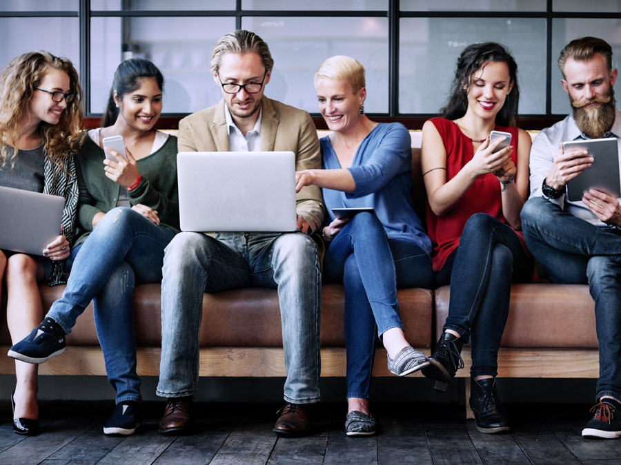 social media moderation services depiction diverse people using laptops smartphones on safe online communities