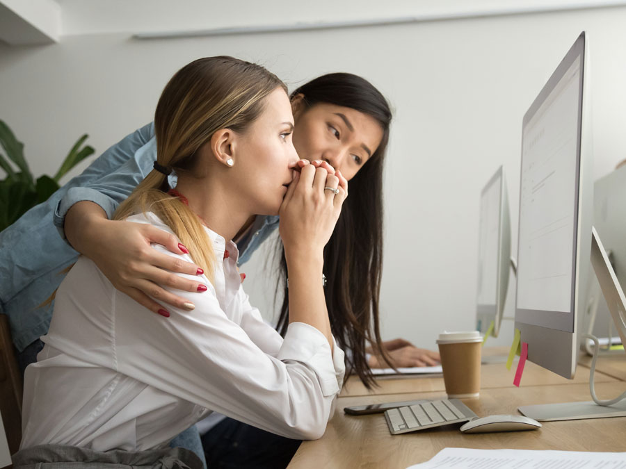 social media moderation services depiction sympathetic outsourcing team leader comforting content moderator 