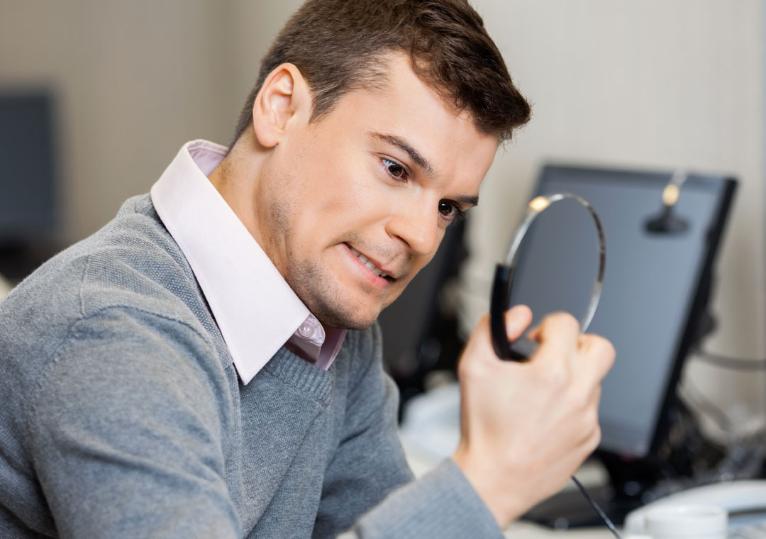 stressed out customer service call center agent holding headphones