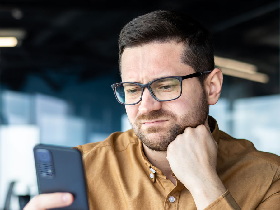 emotional intelligence in call centers disappointed dissatisfied customer looking at smartphone phone