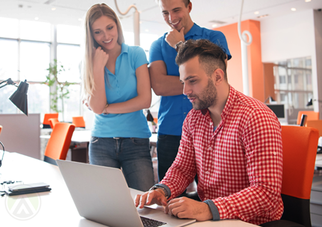young writer and coworkers in office